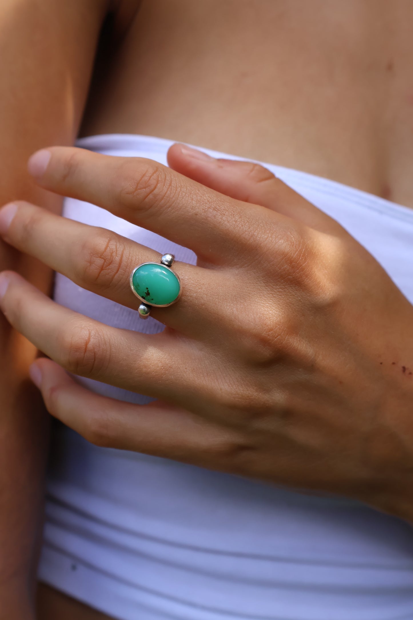 Earthy hammered sterling silver ring set with vibrant green chrysoprase