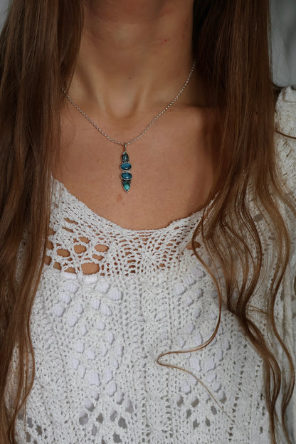 four stone blue pendant