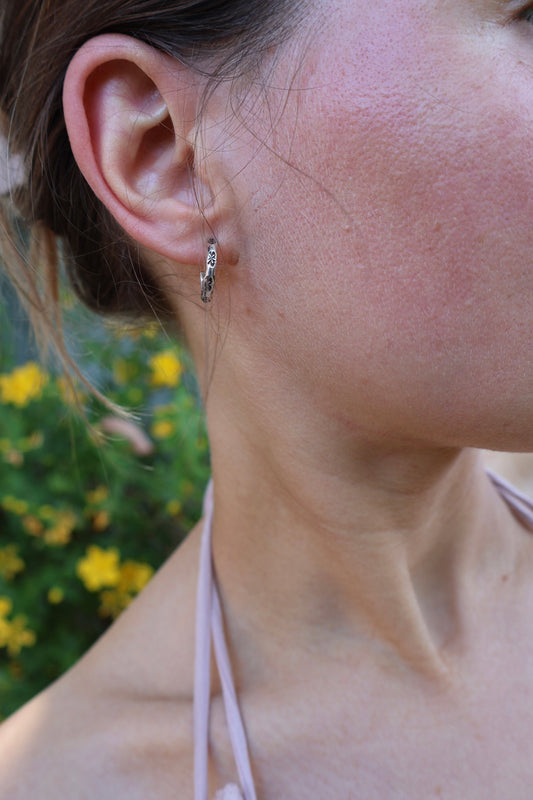 flower stamped sterling silver hooped earrings