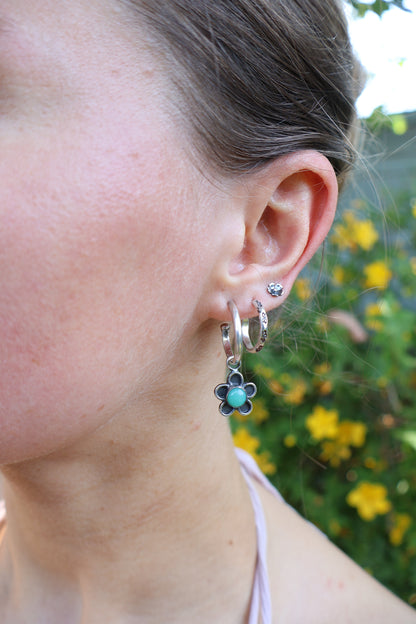 flower stamped sterling silver hooped earrings