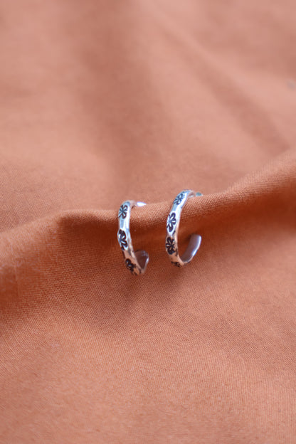 flower stamped sterling silver hooped earrings