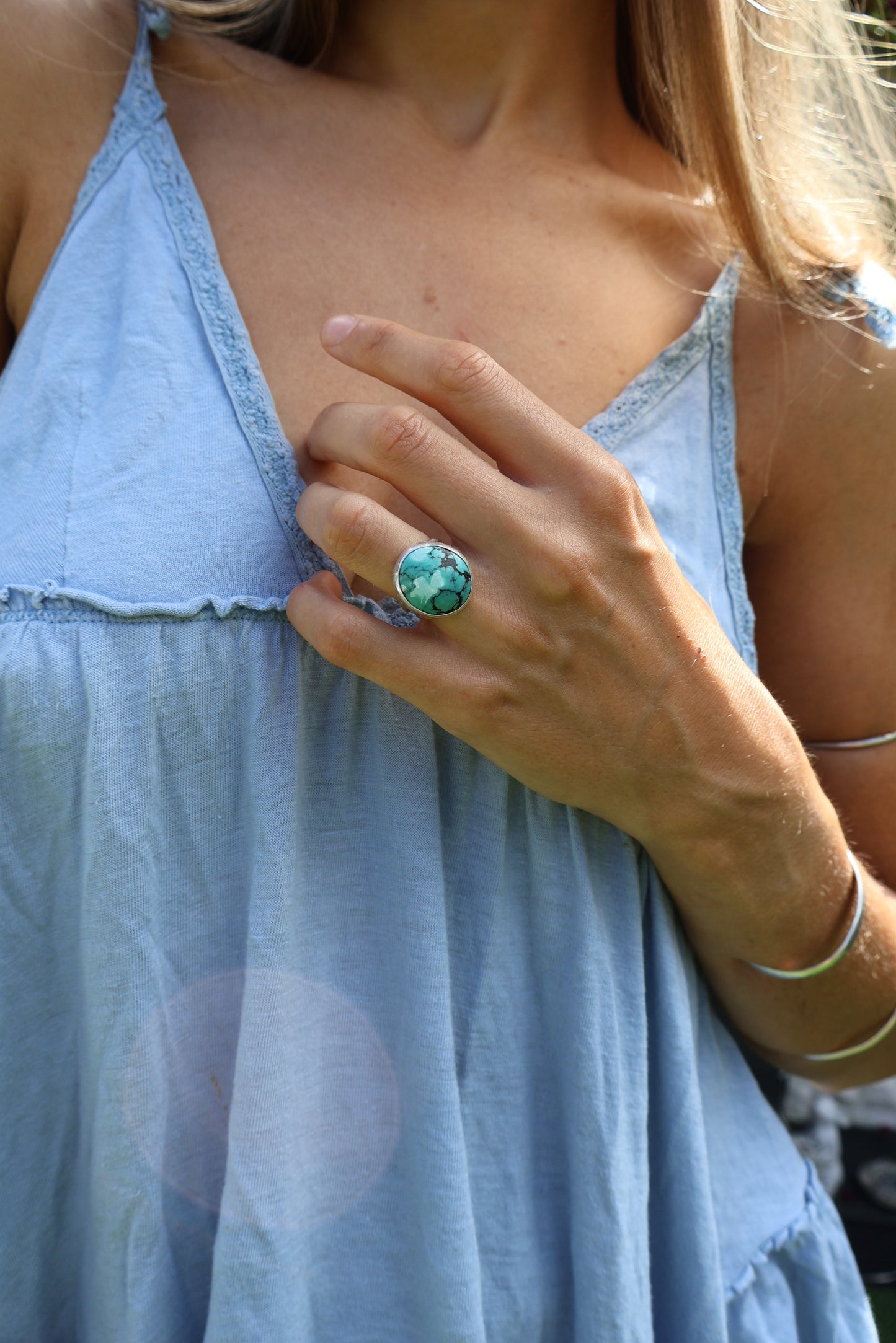 Bohemian woman wearing handmade turquoise statement ring