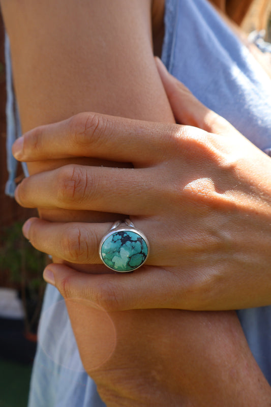 Woman wearing chunky Hubei Tibetan turquoise ring in sterling silver