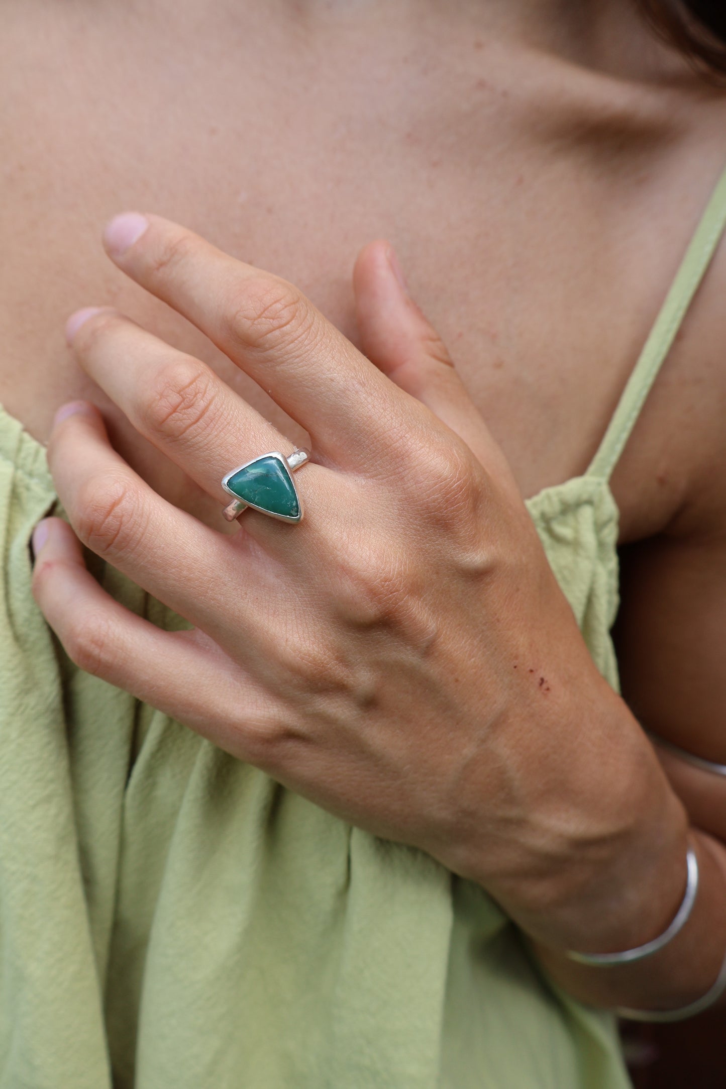 Organic hammered texture band in sterling silver featuring polished green chrysoprase cabochon